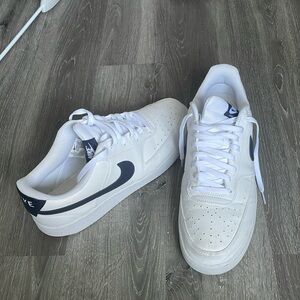 White and dark blue Nike sneakers